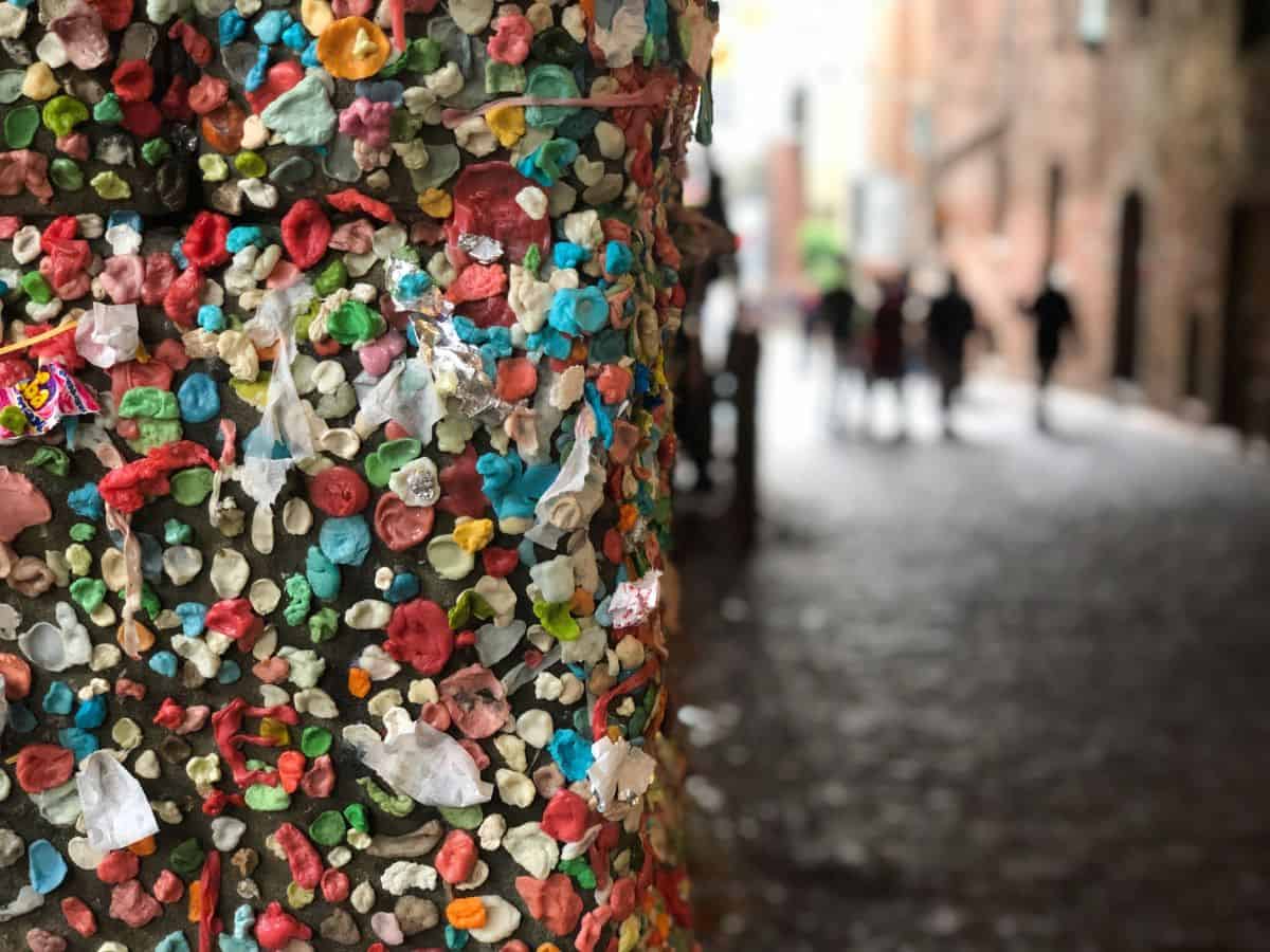 Chewing gum on a pole in a city.
