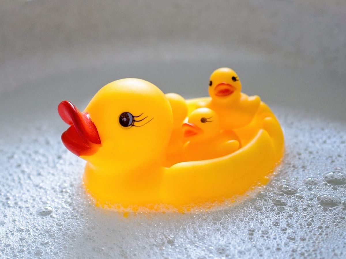 Rubber ducks in a bath tub.