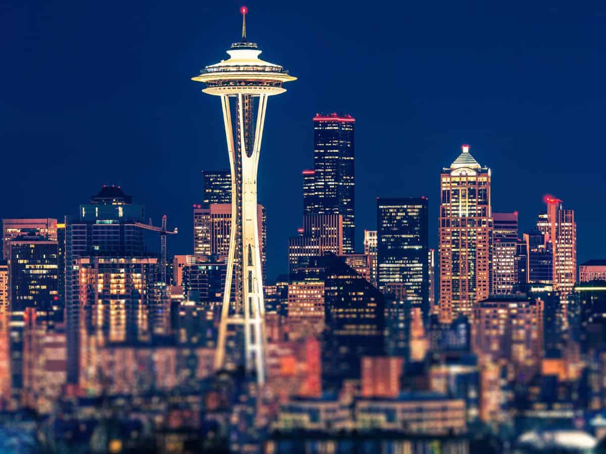 The Seattle skyline is lit up at night.