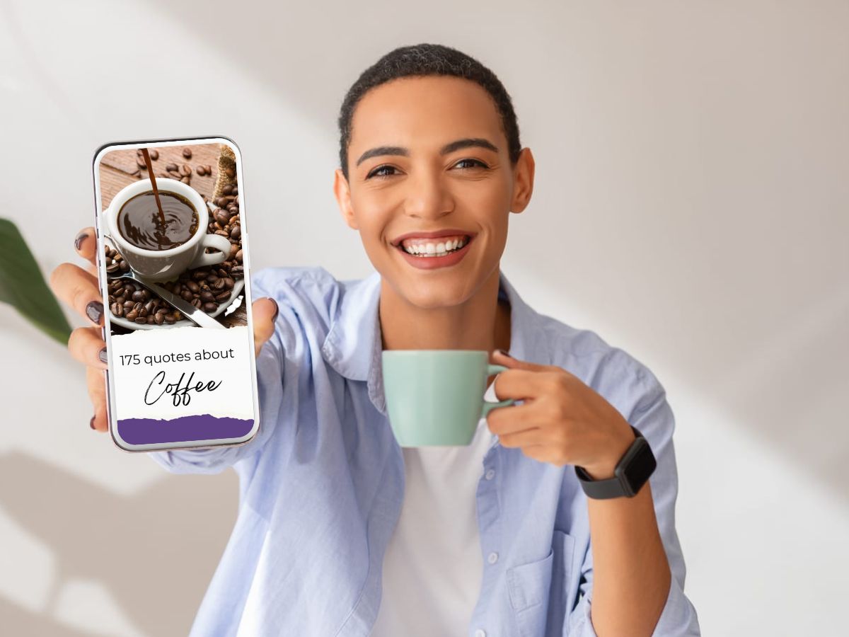 A woman holding up a smartphone with a screen of coffee quotes on it.