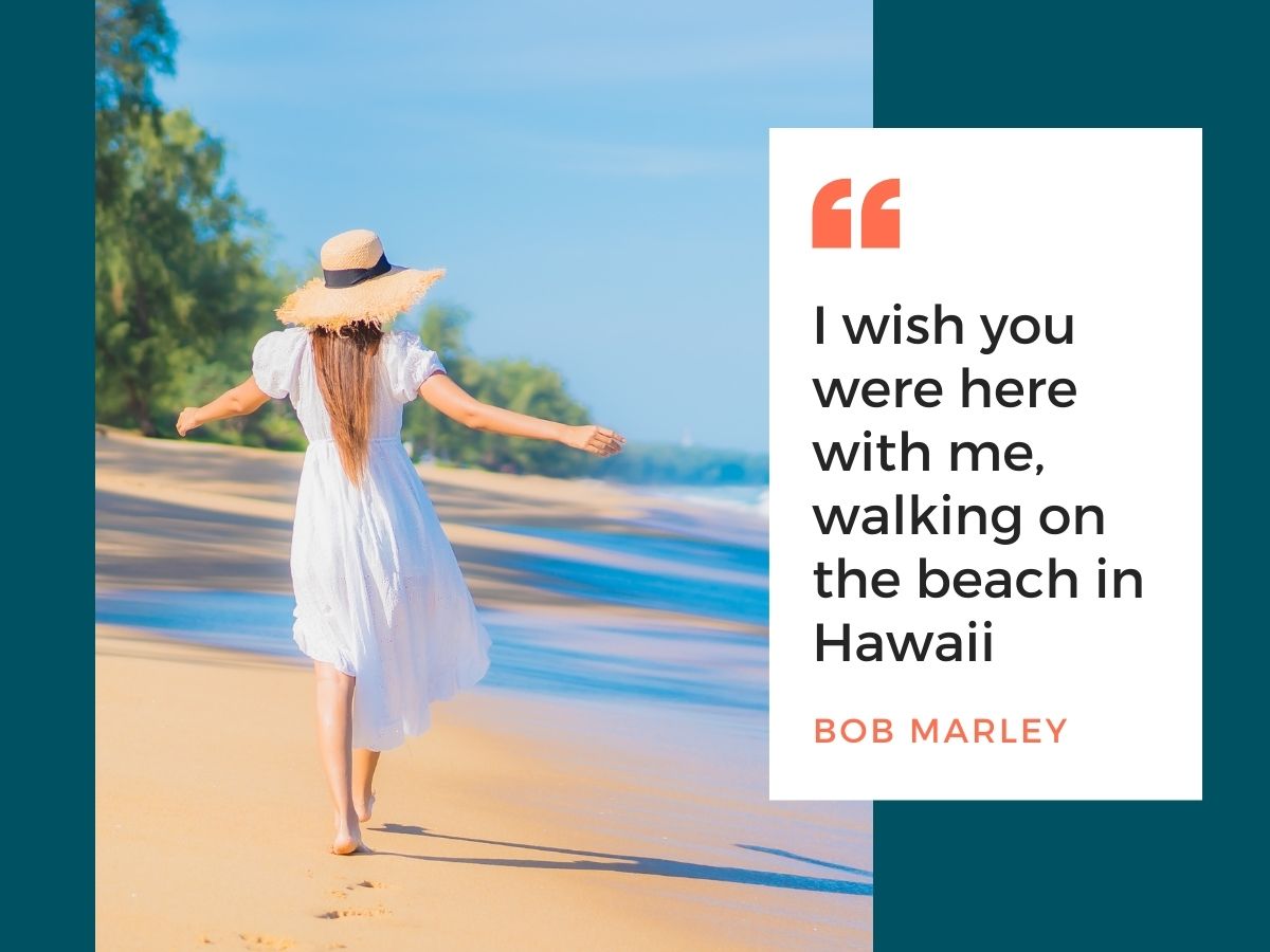 A woman in a white dress and sun hat walks joyfully along a beach, with an inspirational quote by bob marley overlaying the image.
