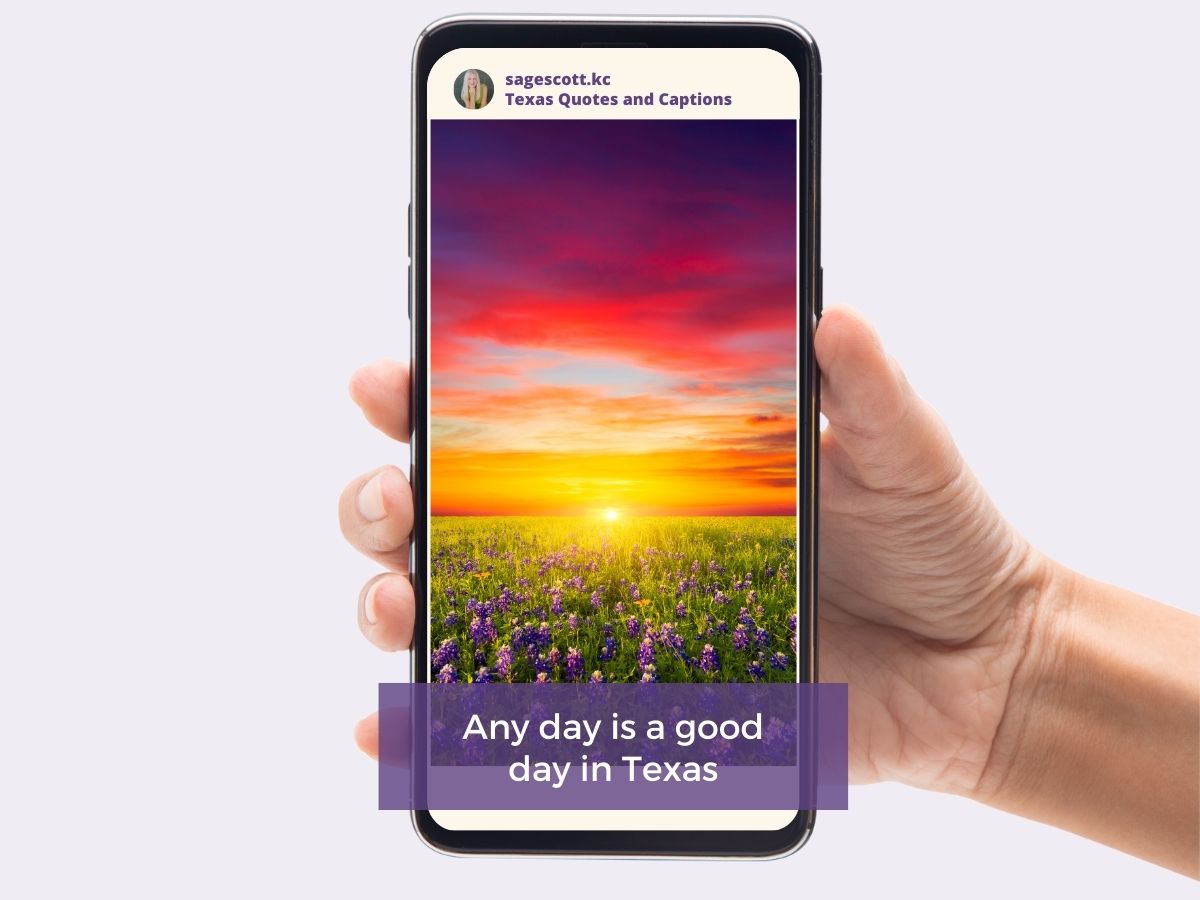 Hand holding a smartphone displaying a sunset scene with text "Any day is a good day in Texas".